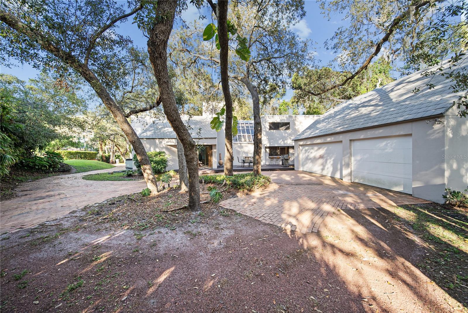 View of the 3 car garage and looking at the back of the home
