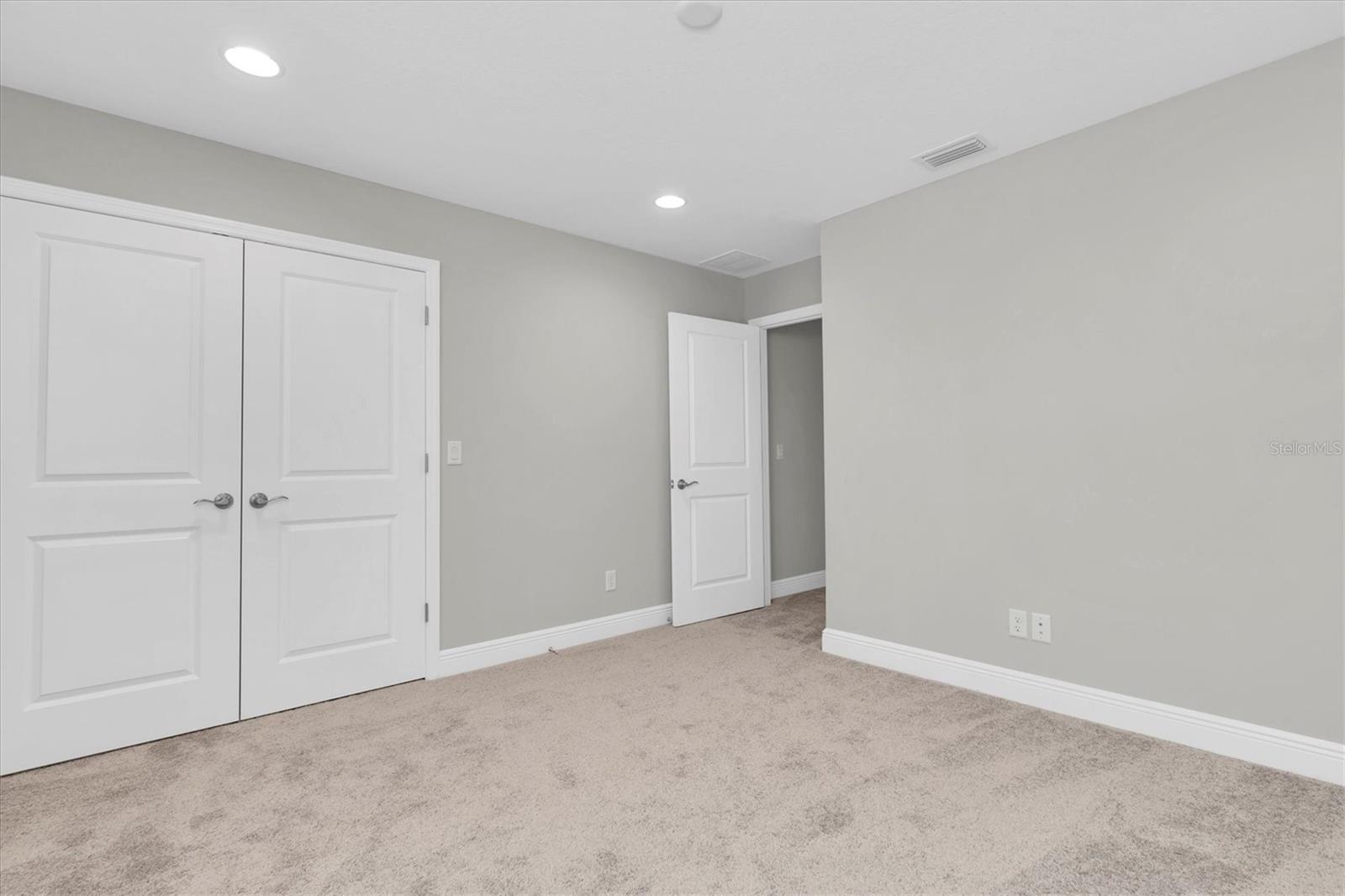 Bedroom 5 with walk in closet.
