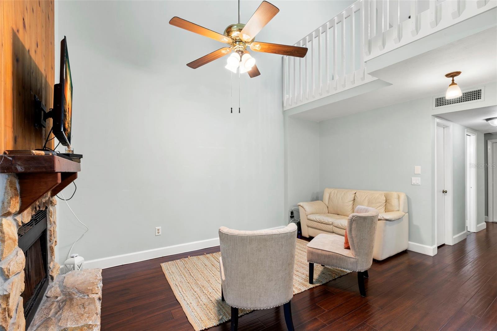 2-story living room with wood burning fireplace