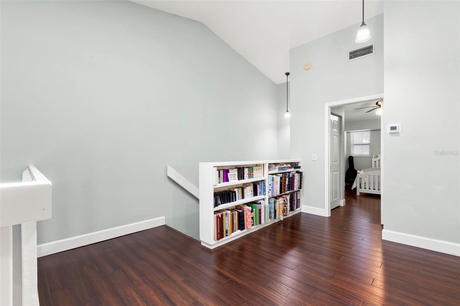 Loft perfect for home office and includes built-in bookshelves