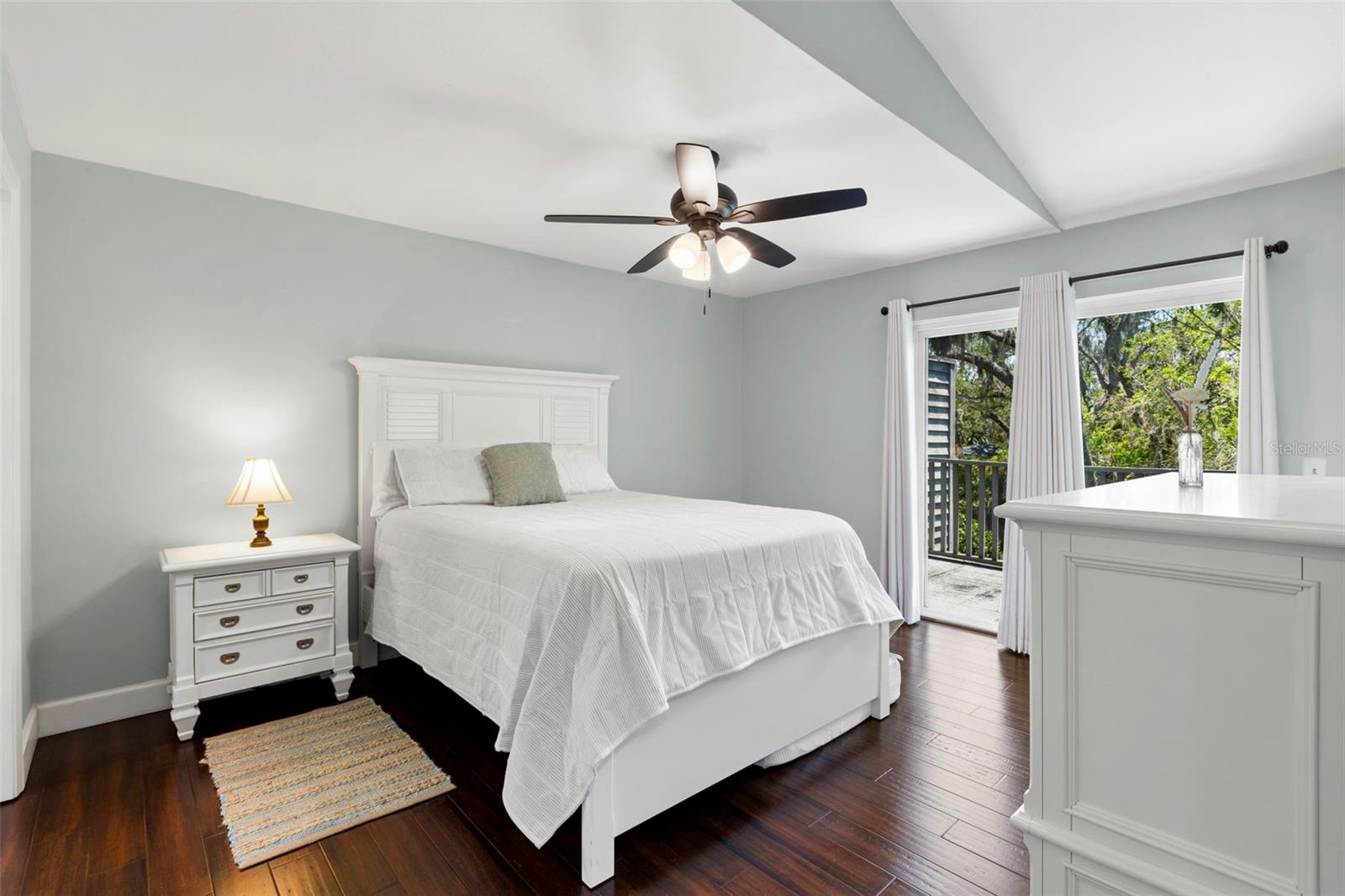 Primary Bedroom suite with sliders opening to balcony