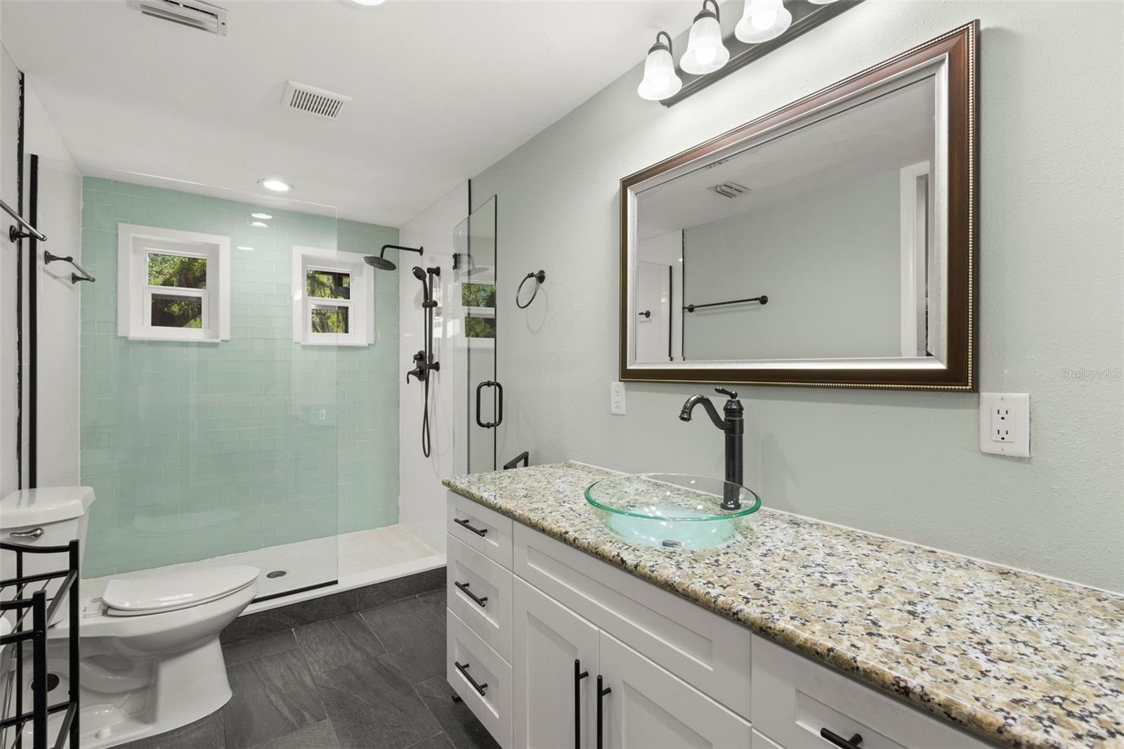 Upgraded en suite primary bath with step-in shower