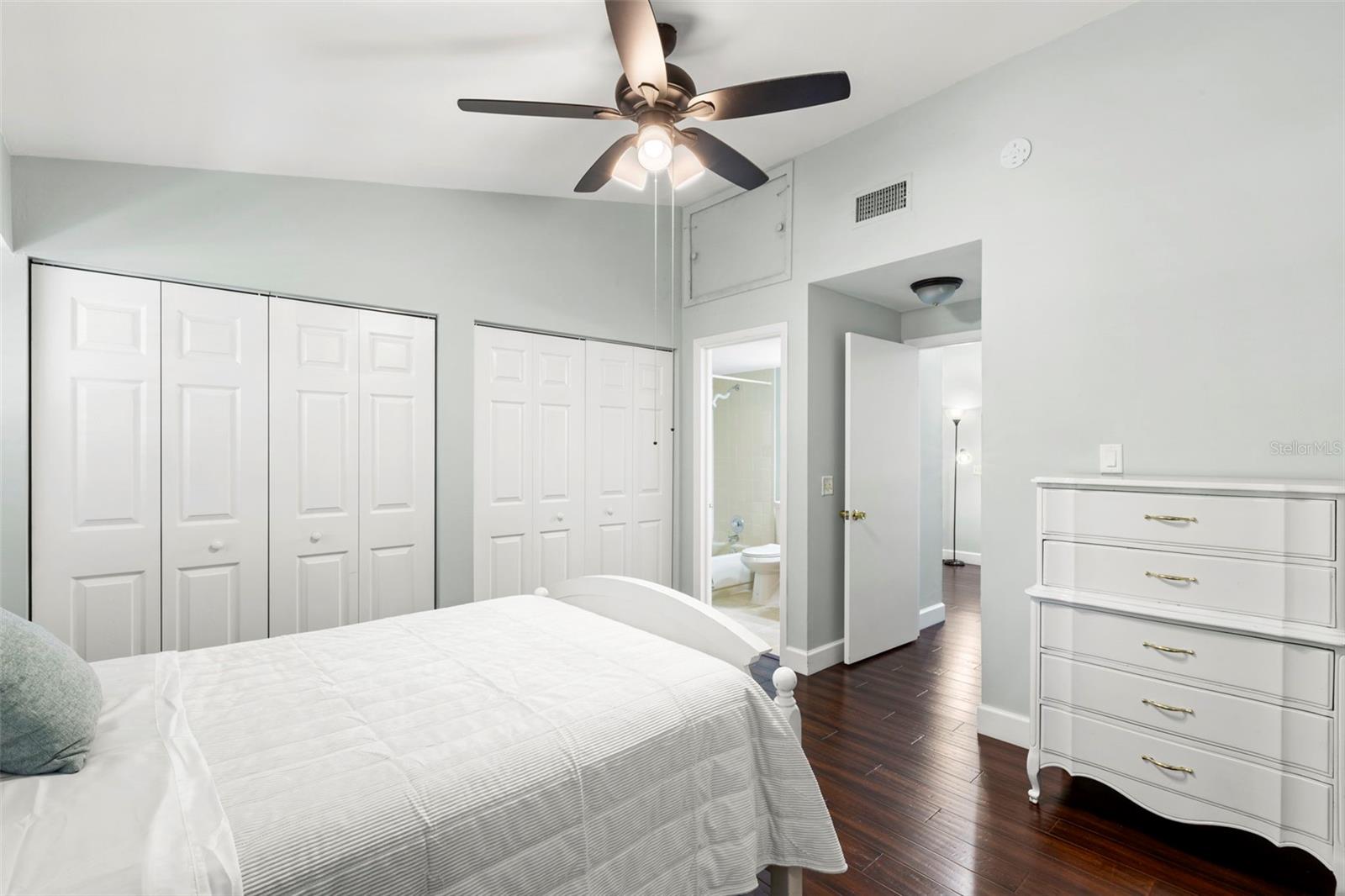 2nd bedroom with dual closets and linen closet and en suite private bath