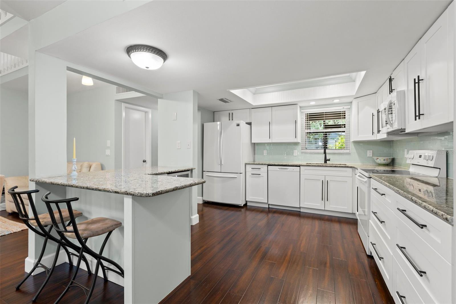 Upgraded kitchen with breakfast bar for barstool seating for casual eat-in kitchen dining