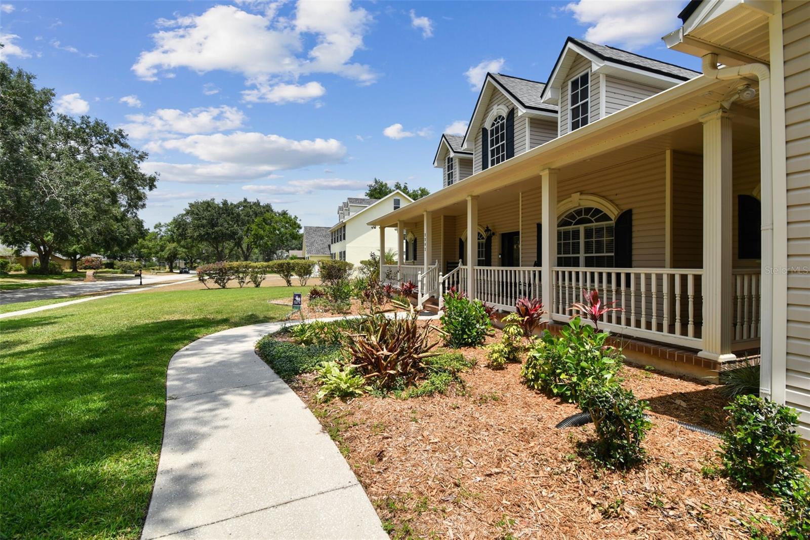 Front exterior view of 2202 Colewood Ln in Dover, Florida – with well maintained landscaping.