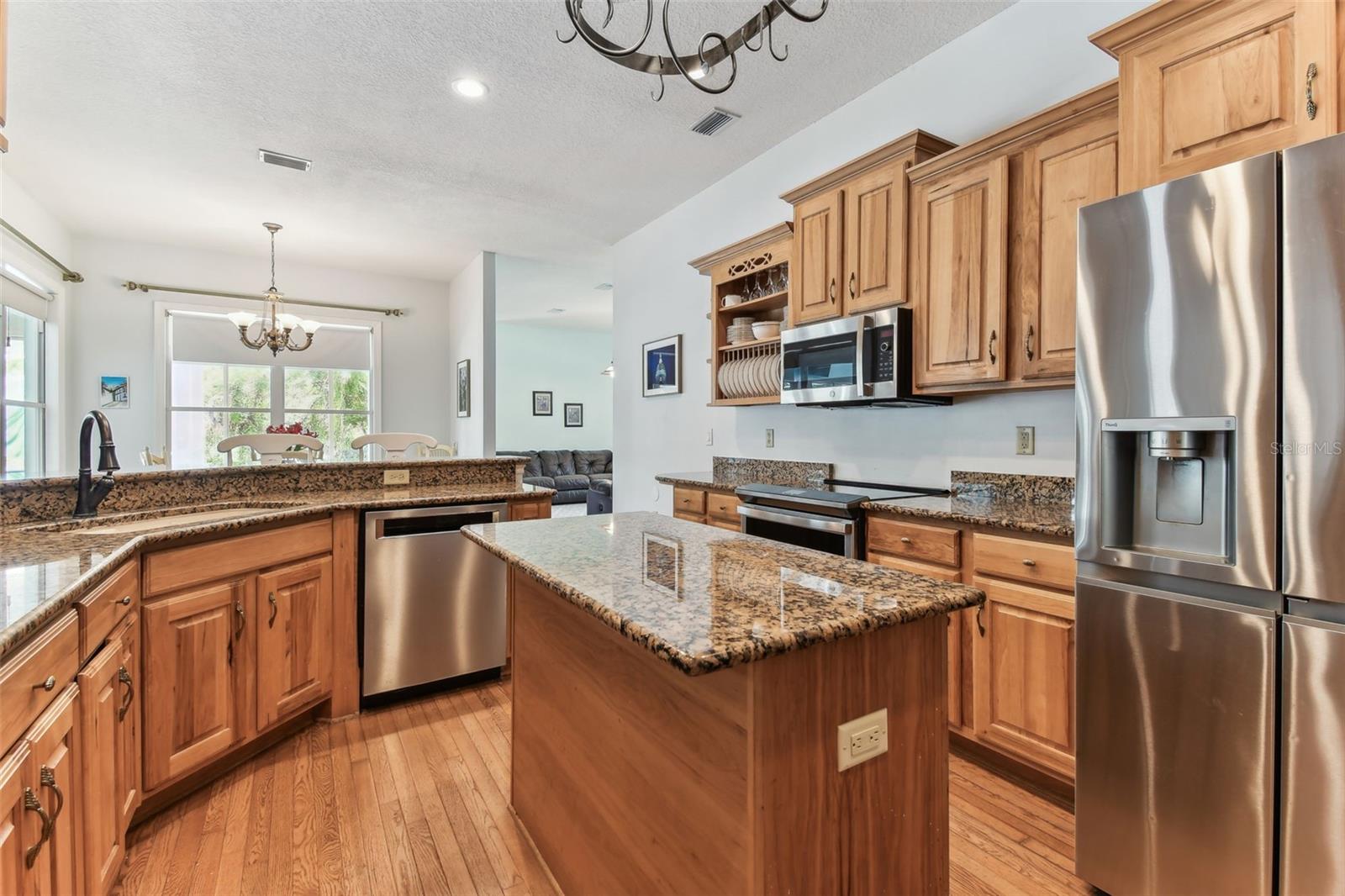 Modern kitchen at 2202 Colewood Ln with granite countertops, stainless steel appliances, and abundant cabinet space.