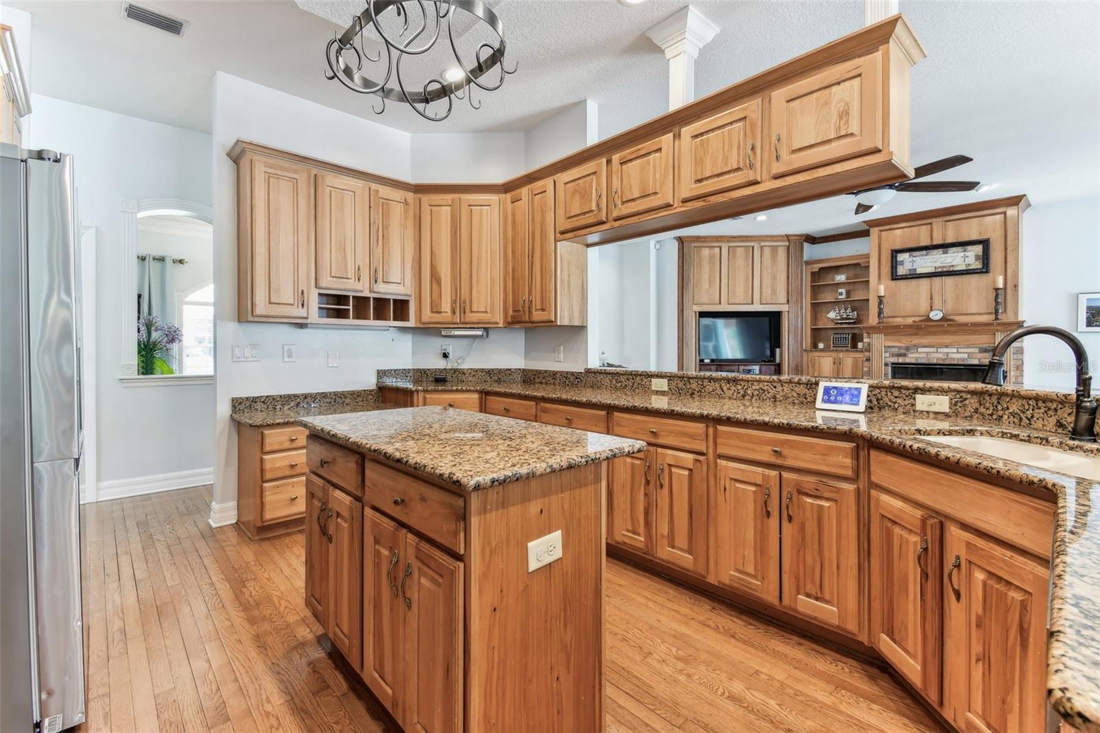 Modern kitchen at 2202 Colewood Ln with granite countertops, stainless steel appliances, and abundant cabinet space.