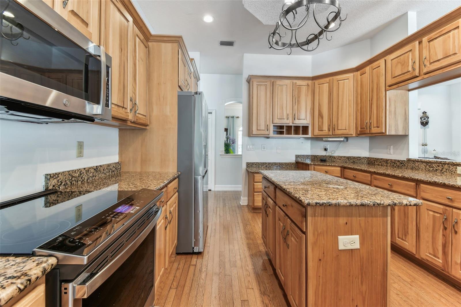 Modern kitchen at 2202 Colewood Ln with granite countertops, stainless steel appliances, and abundant cabinet space.