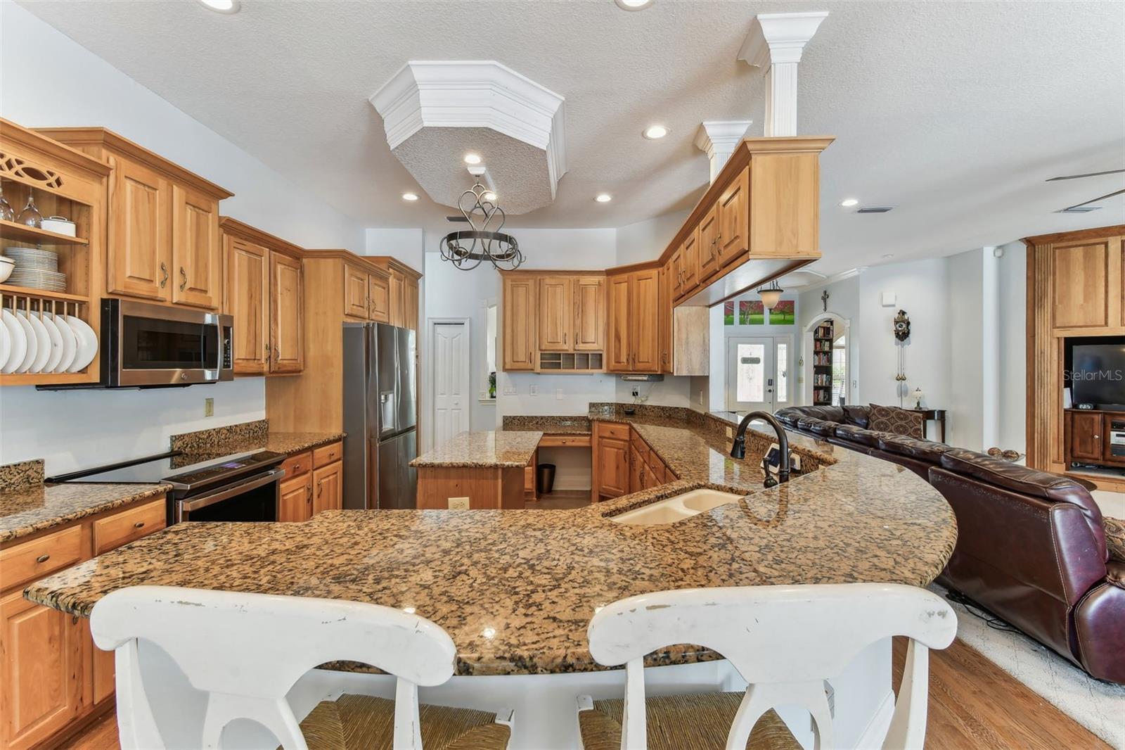Modern kitchen at 2202 Colewood Ln with granite countertops, stainless steel appliances, and abundant cabinet space.