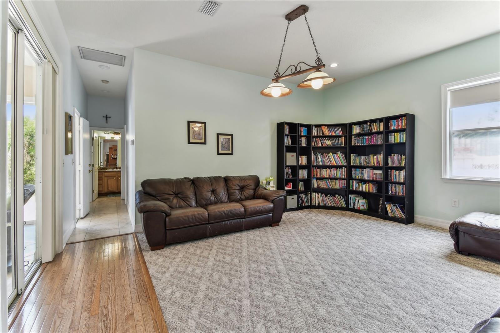 Cozy family room ideal for movie nights or gatherings, with direct access to the outdoor living space.