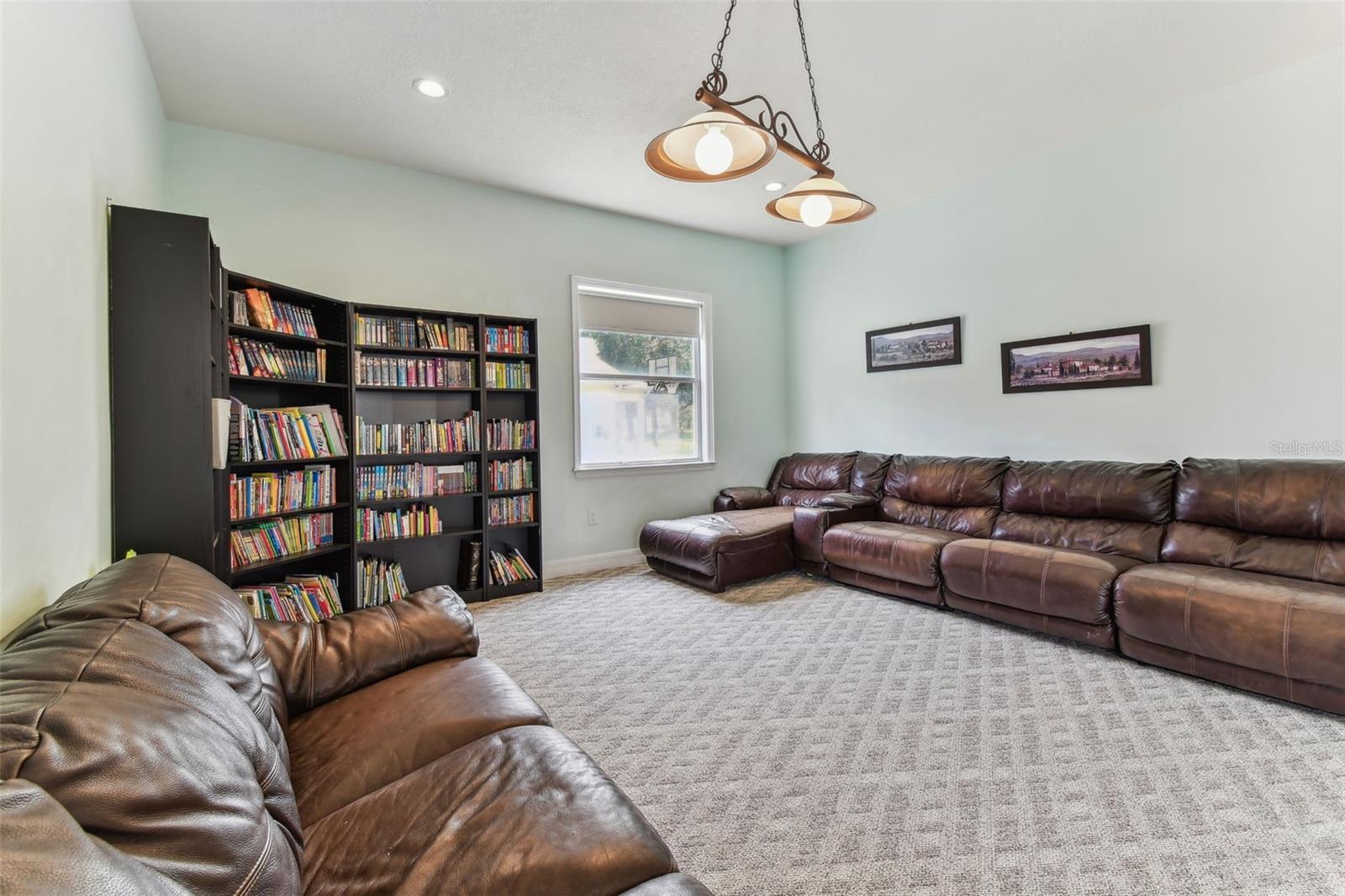 Cozy family room ideal for movie nights or gatherings, with direct access to the outdoor living space.
