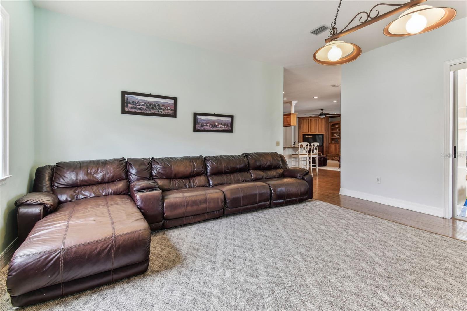 Cozy family room ideal for movie nights or gatherings, with direct access to the outdoor living space.