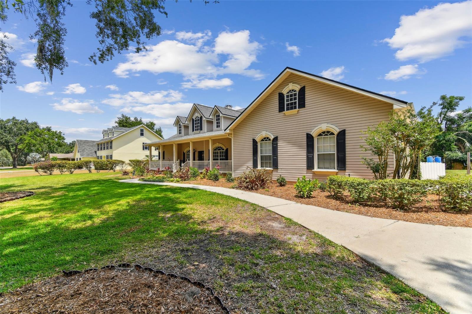 Front exterior view of 2202 Colewood Ln in Dover, Florida – with well maintained landscaping.