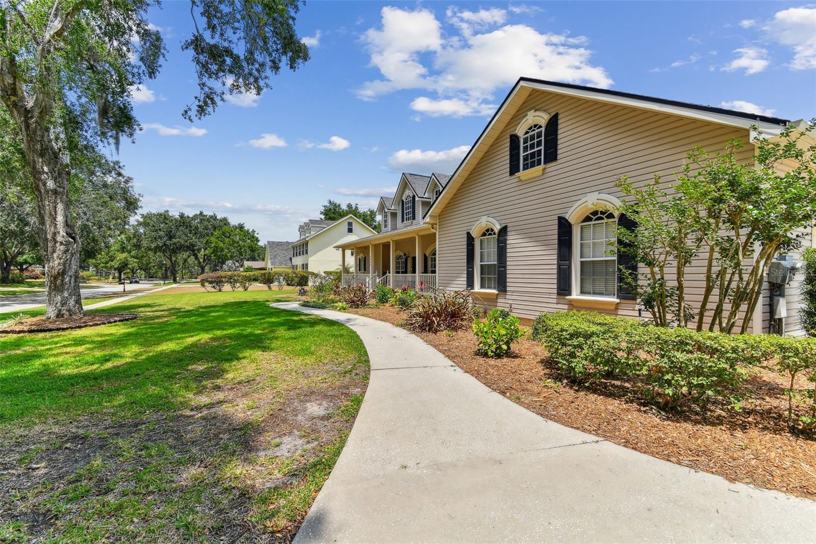 Front exterior view of 2202 Colewood Ln in Dover, Florida – with well maintained landscaping.