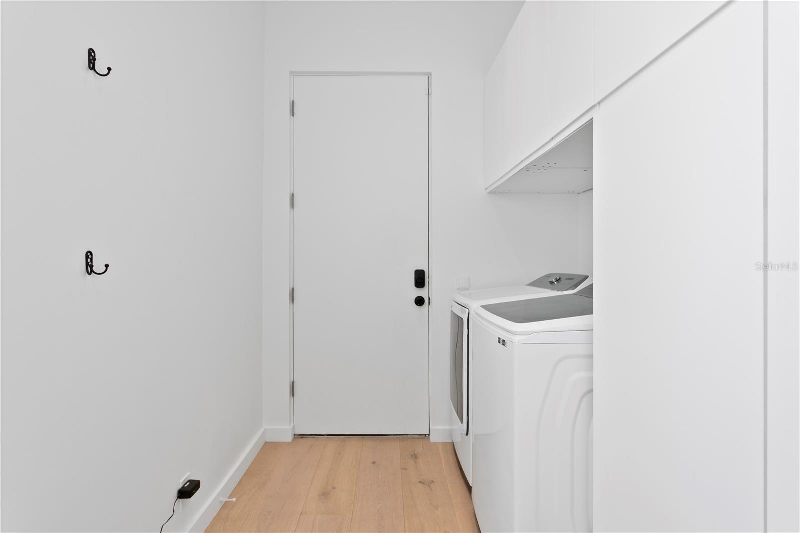 Laundry leading to alleyway and garage access