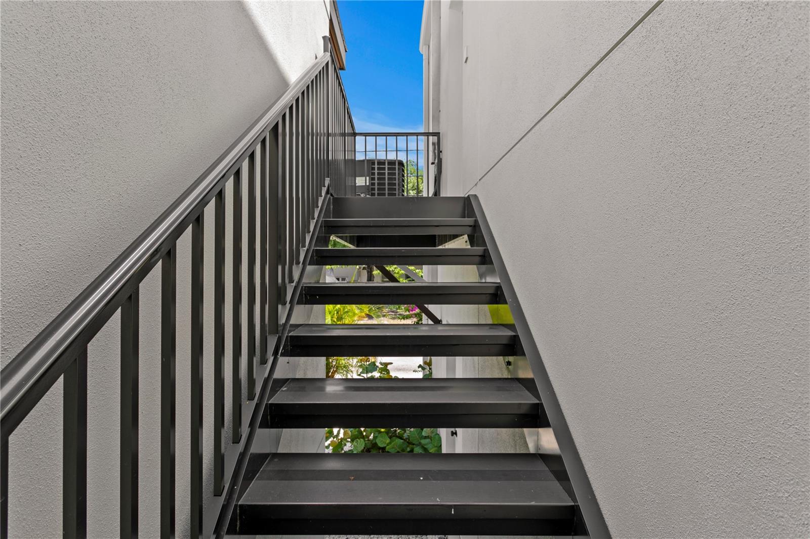 Stairs leading to 2-bedroom suite
