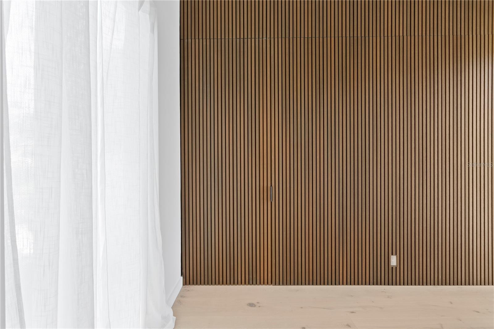 Hidden door leading to primary suite