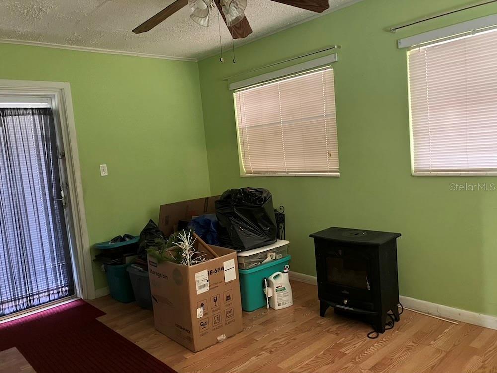 FLORIDA ROOM - DOOR ON THE LEFT LEADS TO THE SCREENED IN LANAI