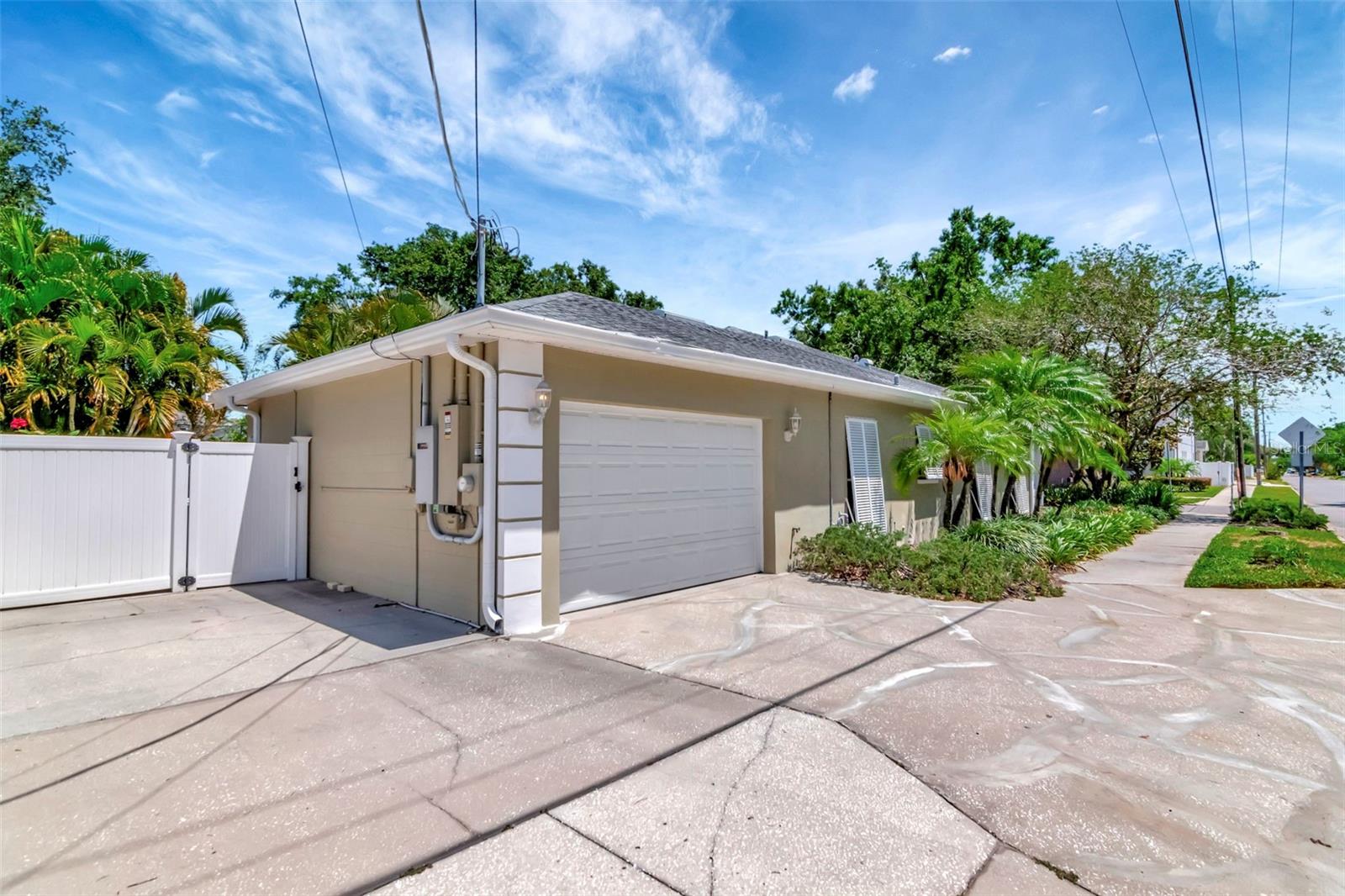Oversized one car garage plus two parking pads for a second car, golf cart, boat or RV.
