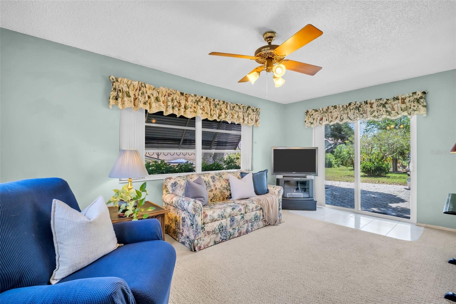 Florida room with hurricane impact slider out to spacious patio~