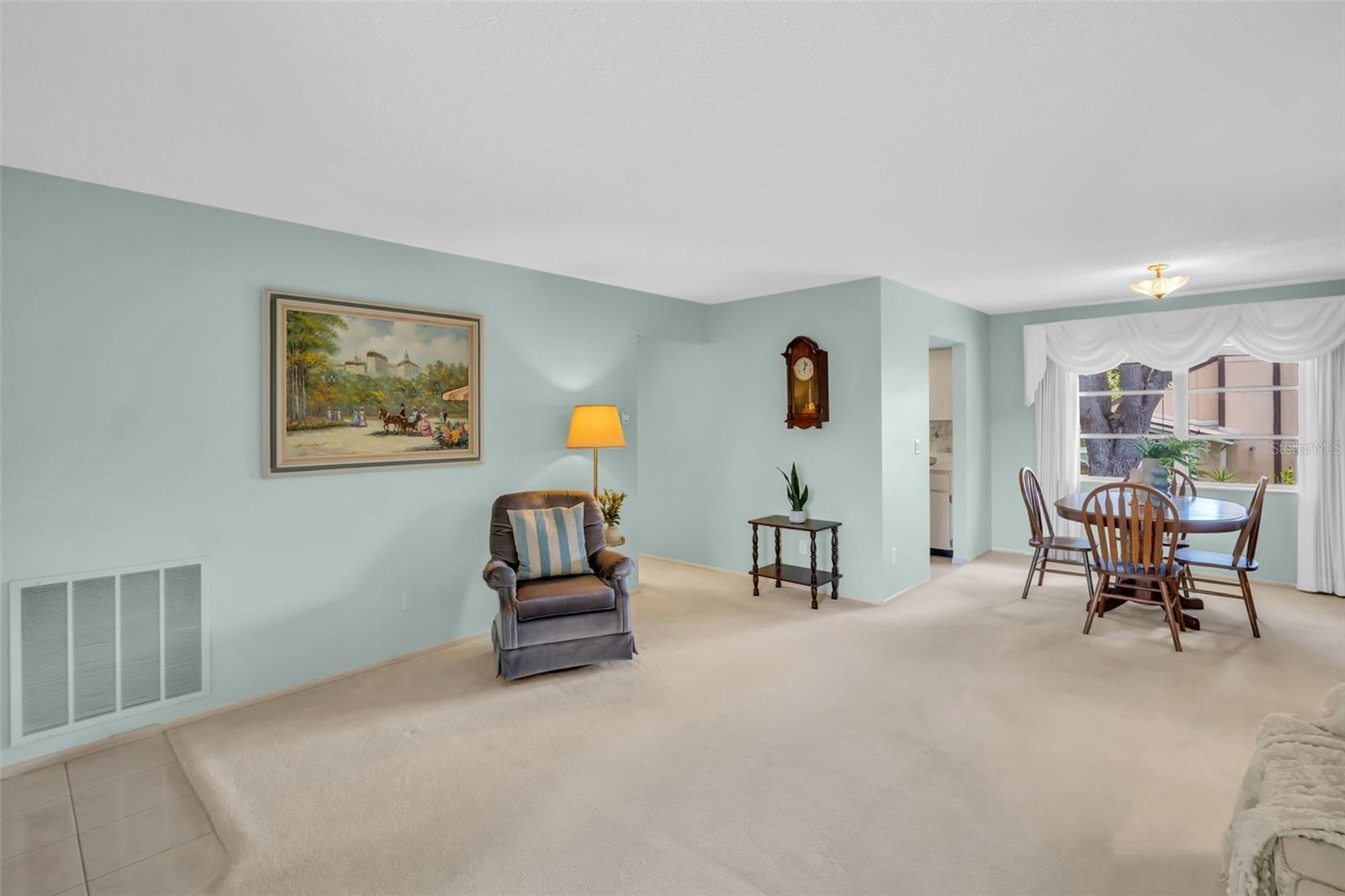 Living/dining room combo perfectly tucked between the kitchen & bedrooms~