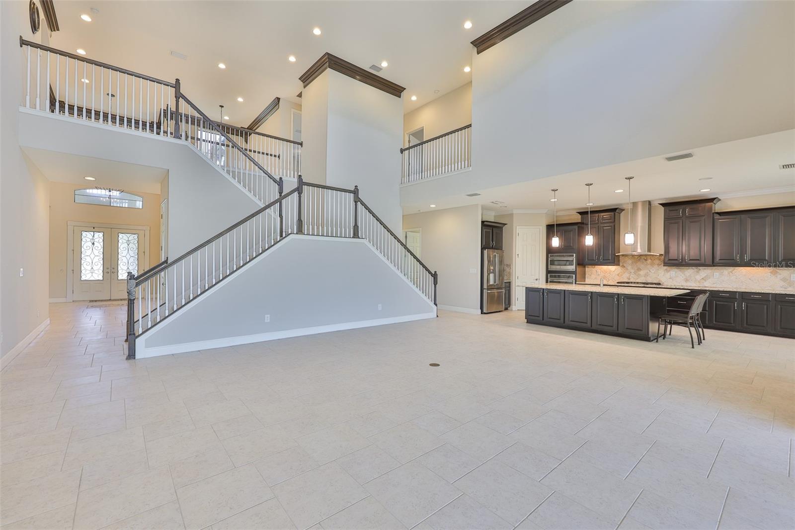 Living room and double entrance staircase