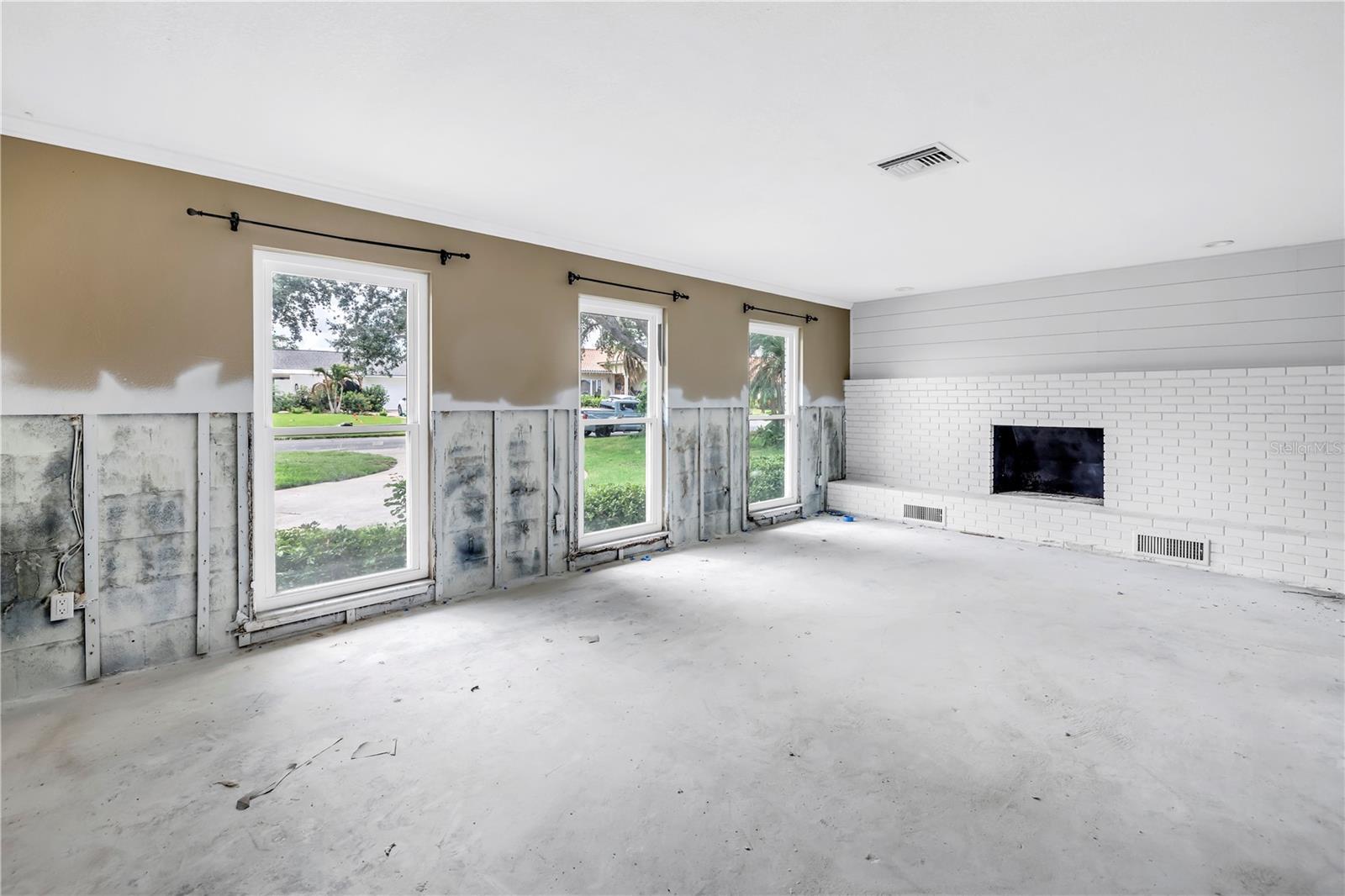 Living room with wood burning fireplace