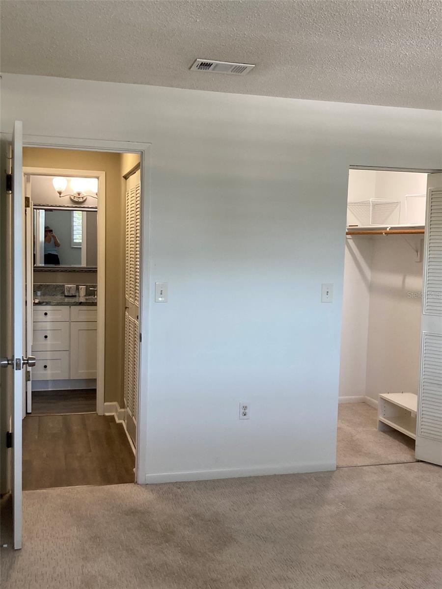 Bedroom looking at hall bath and walk in closet