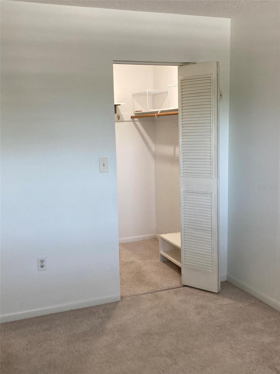 Walk in closet in bedroom