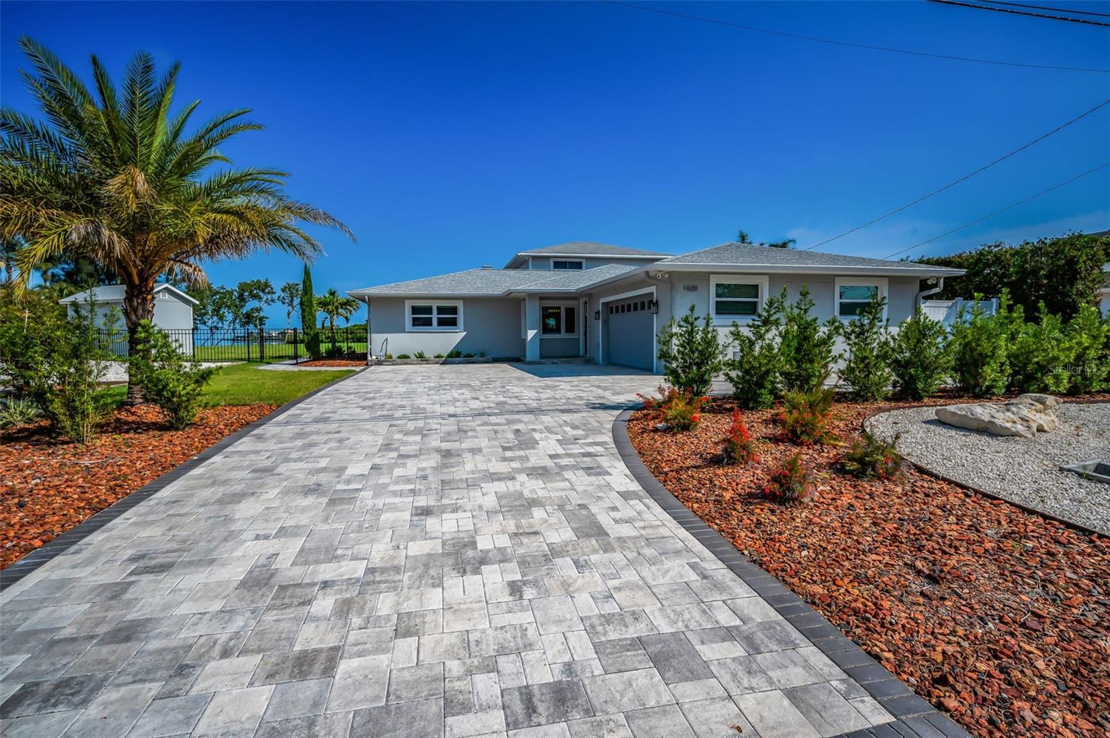 Meticulously Landscaped Fully Fenced over a 1/2 acre