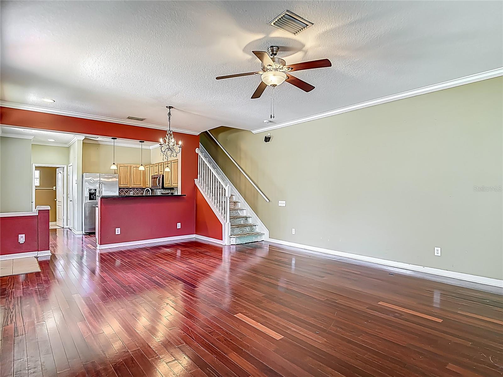 View from great room towards the kitchen, pantry closet, powder room and garage entrance.