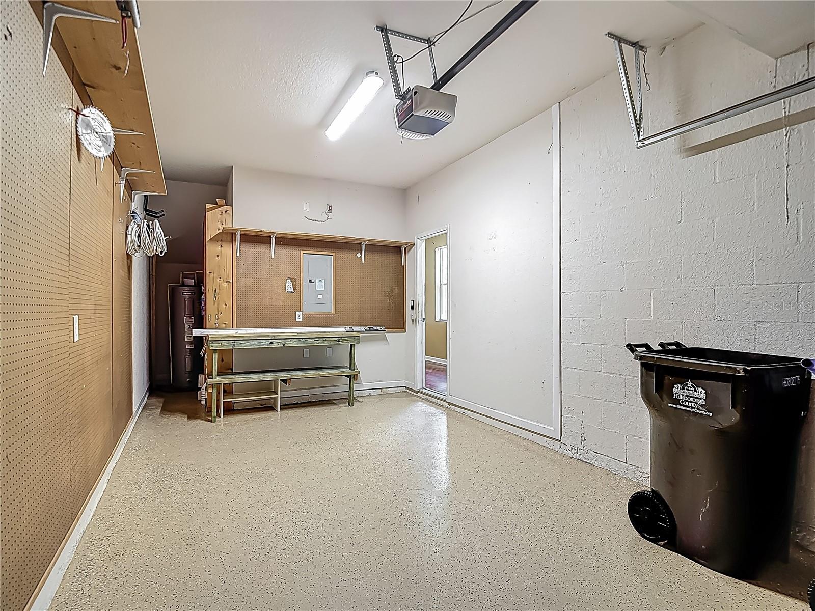 1 car garage. Water heater area has built in extra shelving