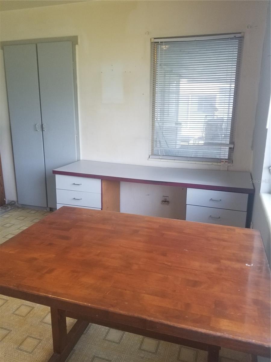 Eat in kitchen looking towards work space and pantry.