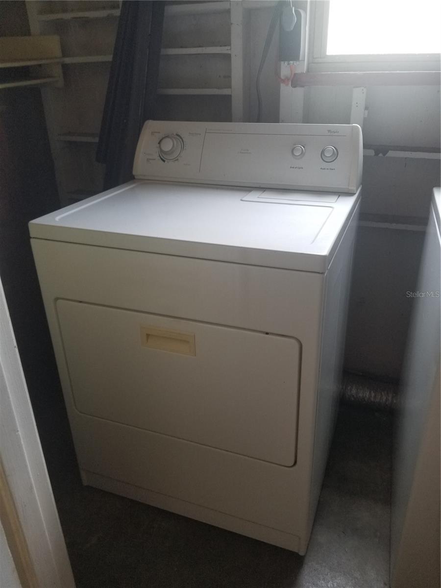 Dryer in laundry storage room.