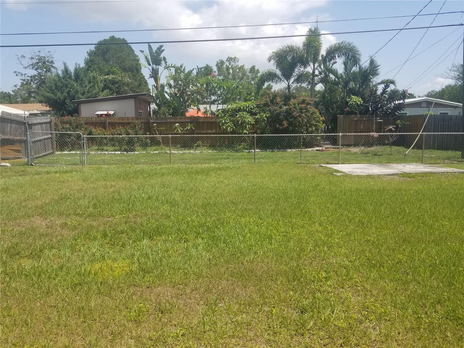 Back yard. Strip of land beyond fence is a power right away.