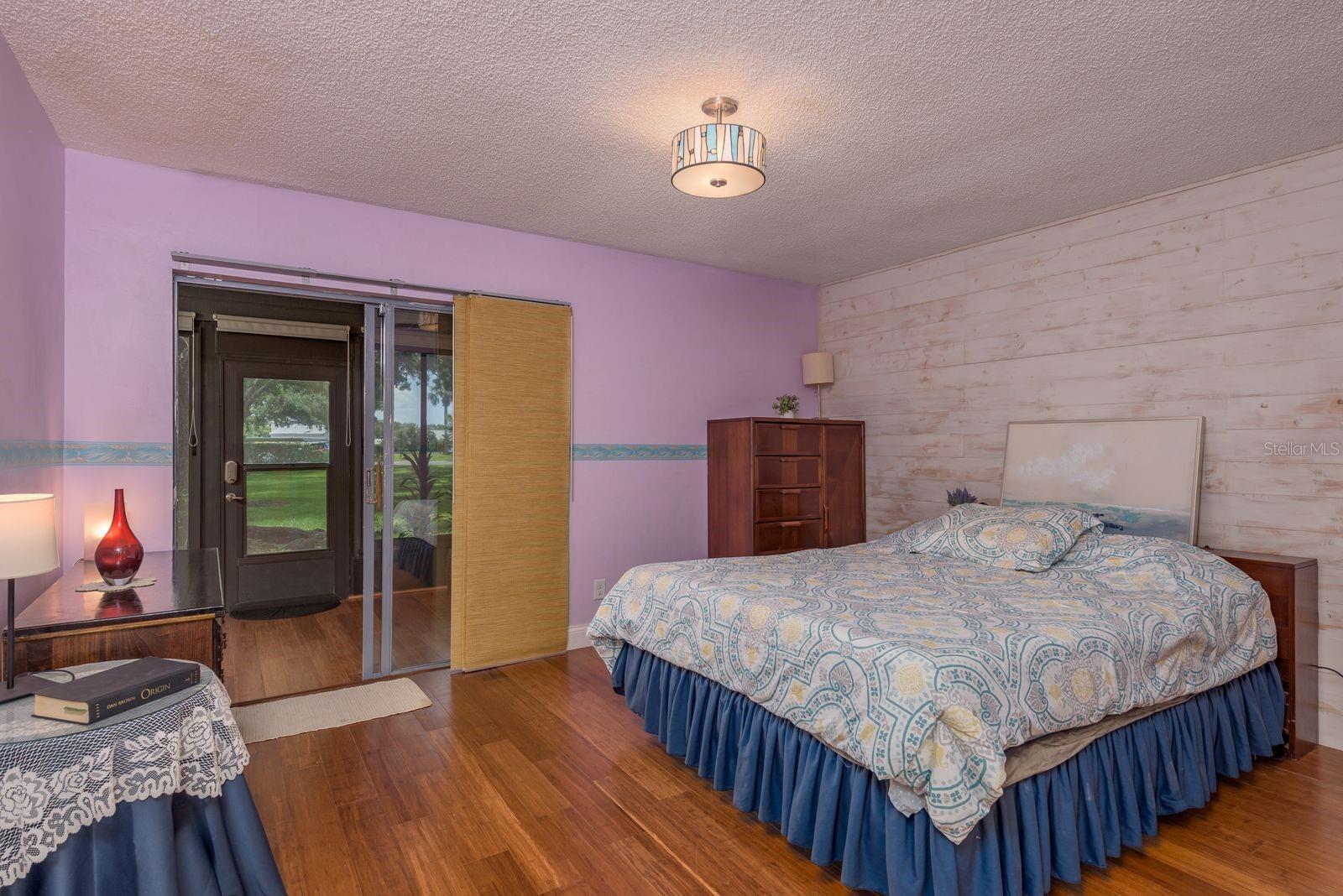 Master Bedroom w/ Feature Wall and Access to Sun Porch / Bonus Room