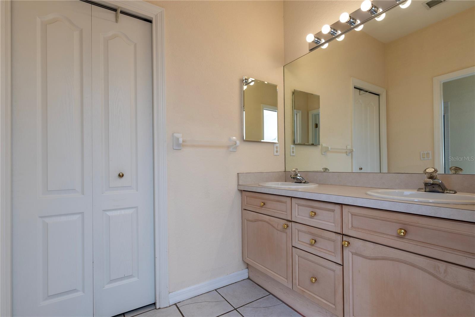 Primary bathroom with dual sinks.