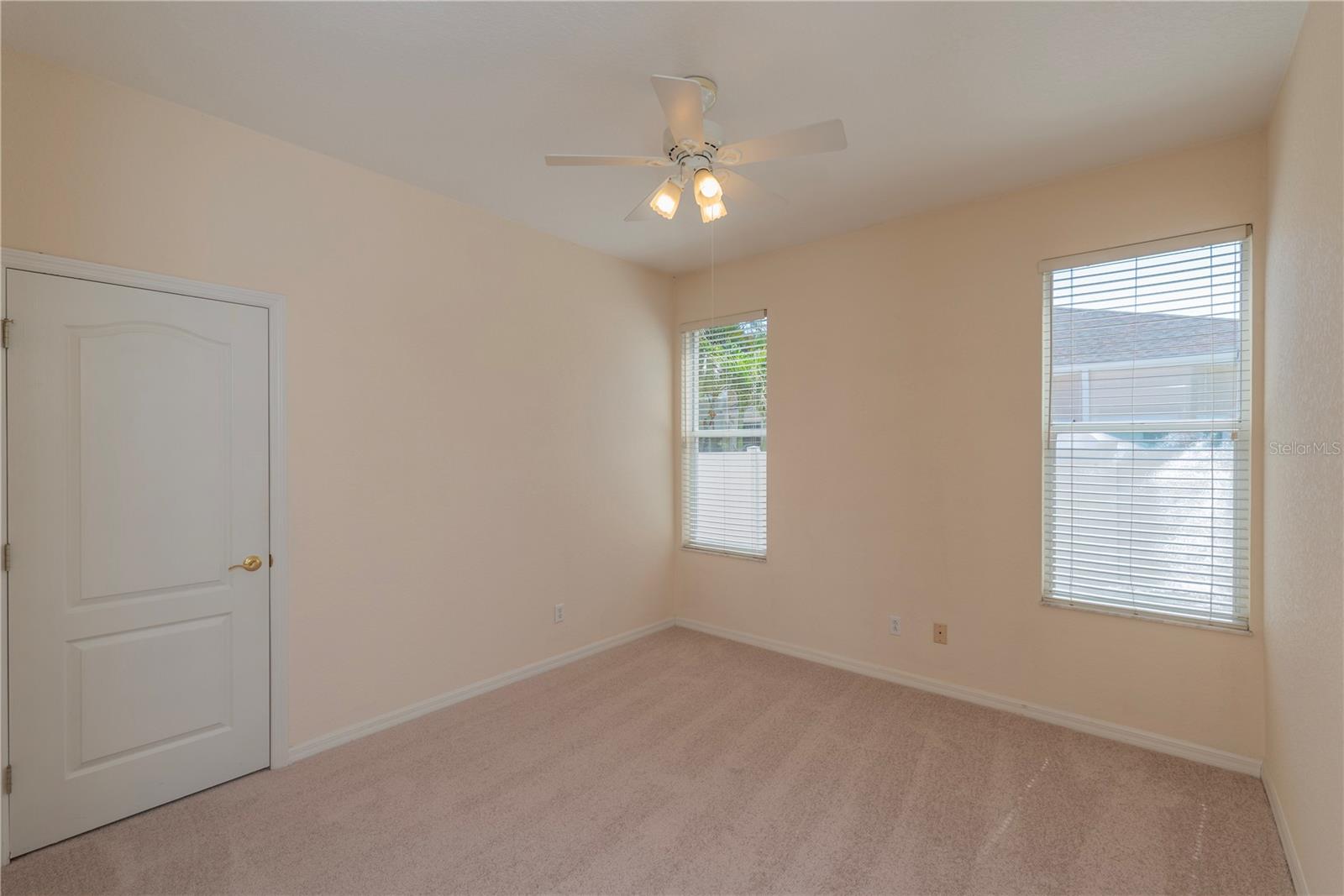Bedroom 2 with new carpet and walk in closet.