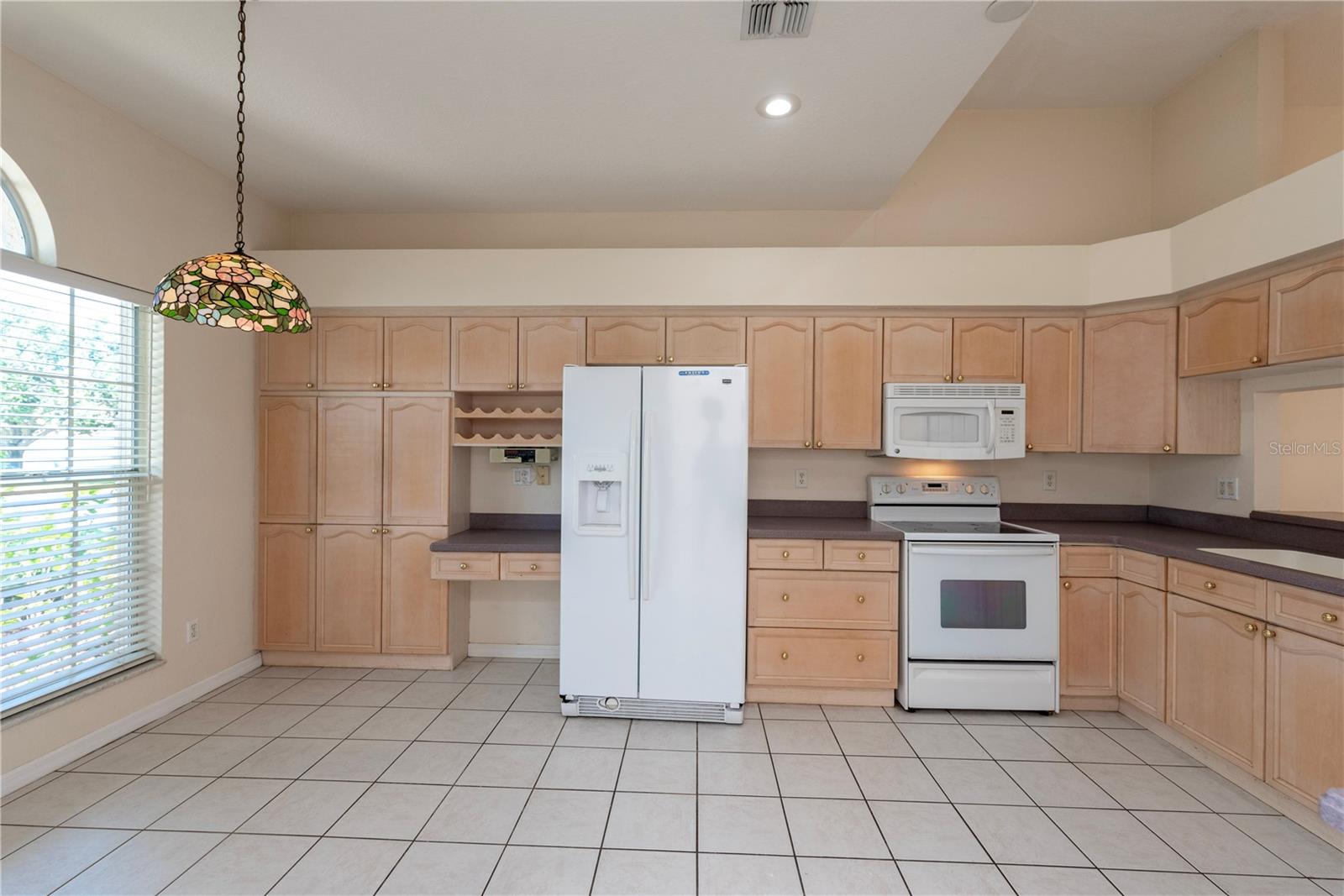 Large kitchen with eat in area.