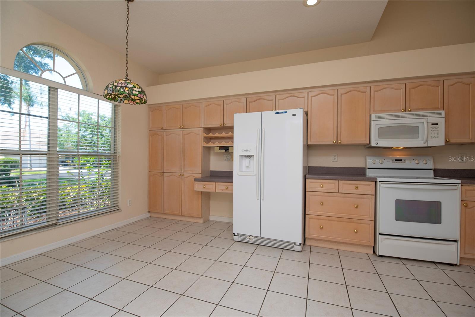 Large kitchen with eat in area.