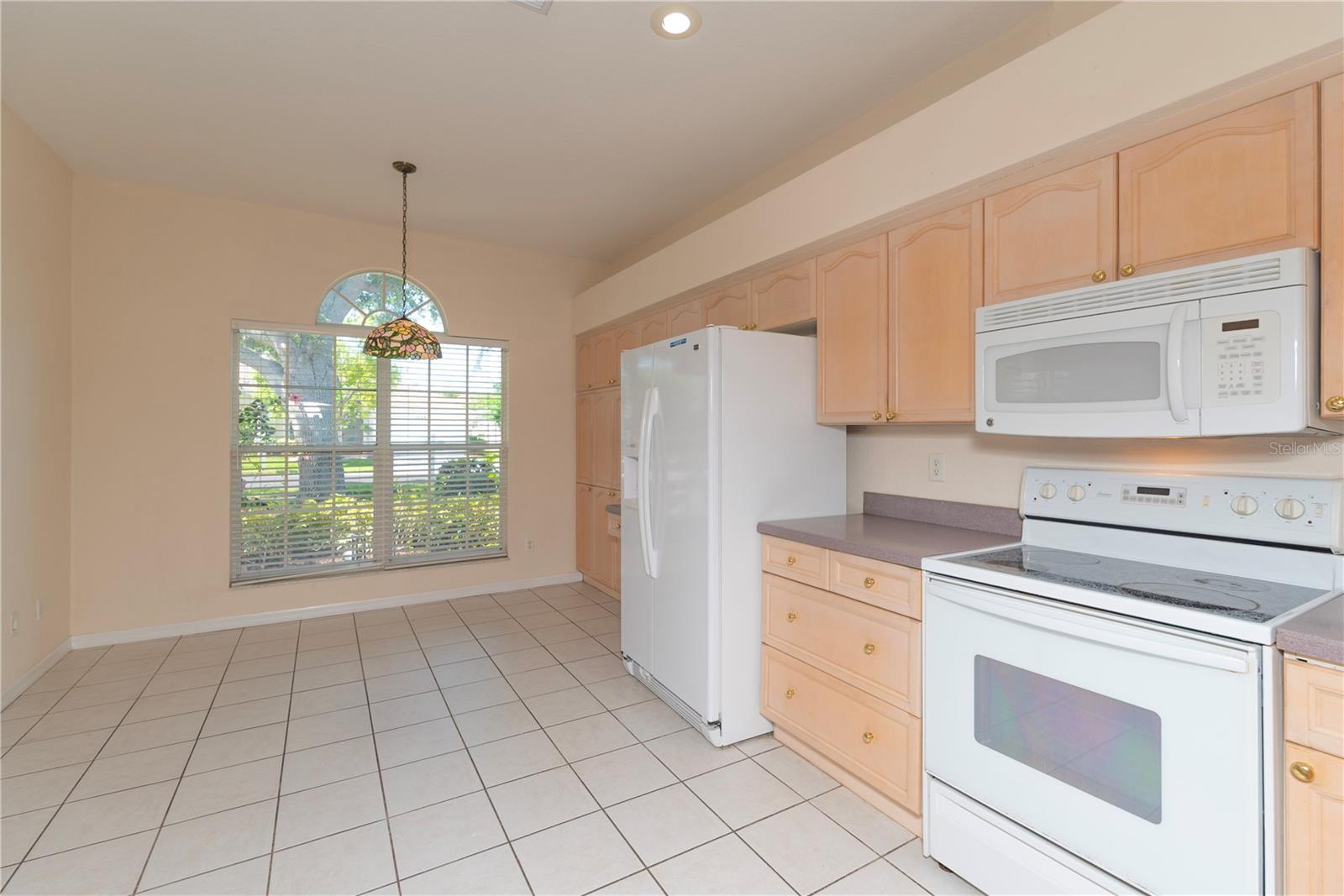 Large kitchen with eat in area.