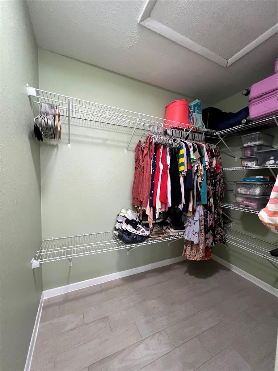 Primary bedroom walk in closet