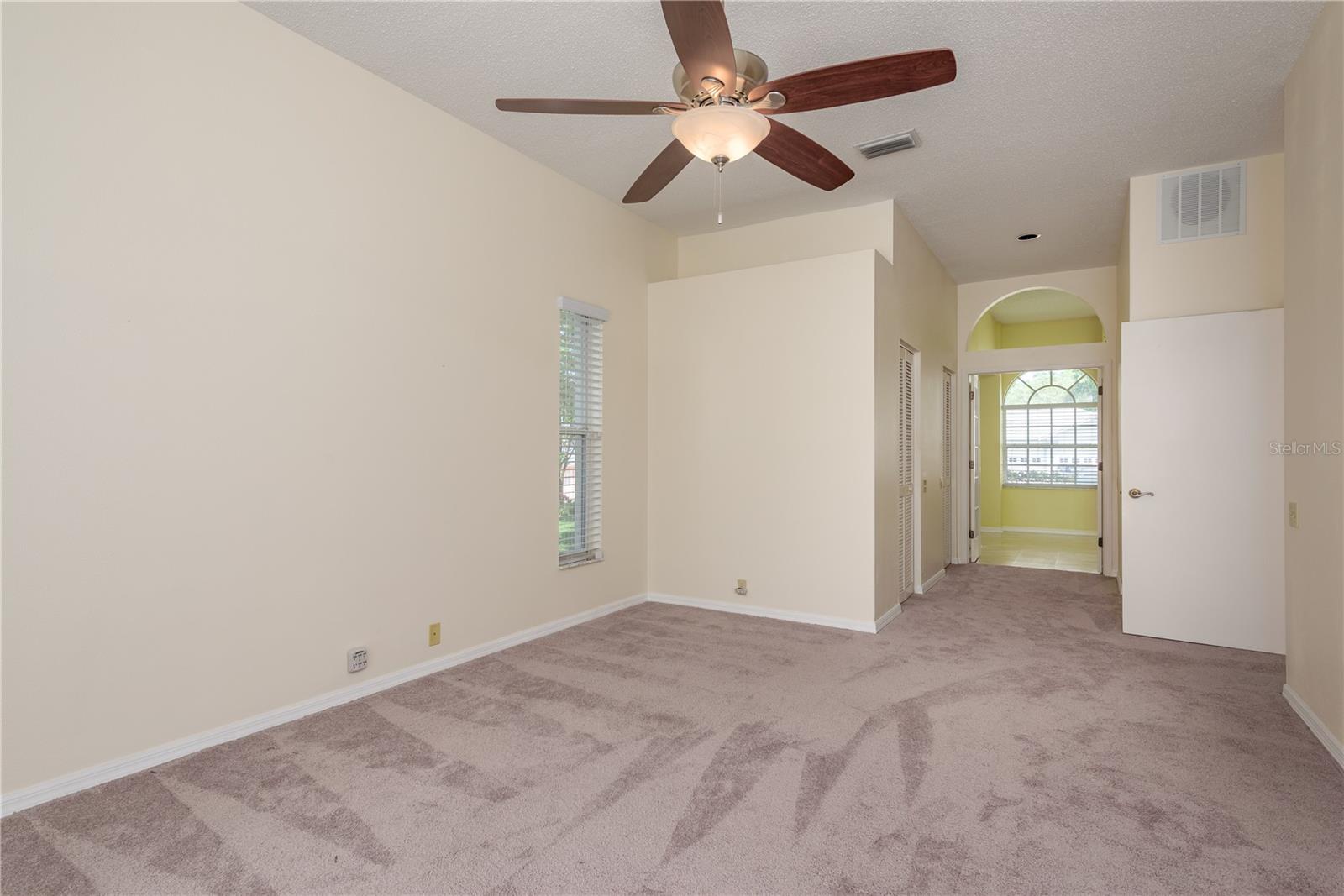 Primary Bedroom with view of Primary Bathroom