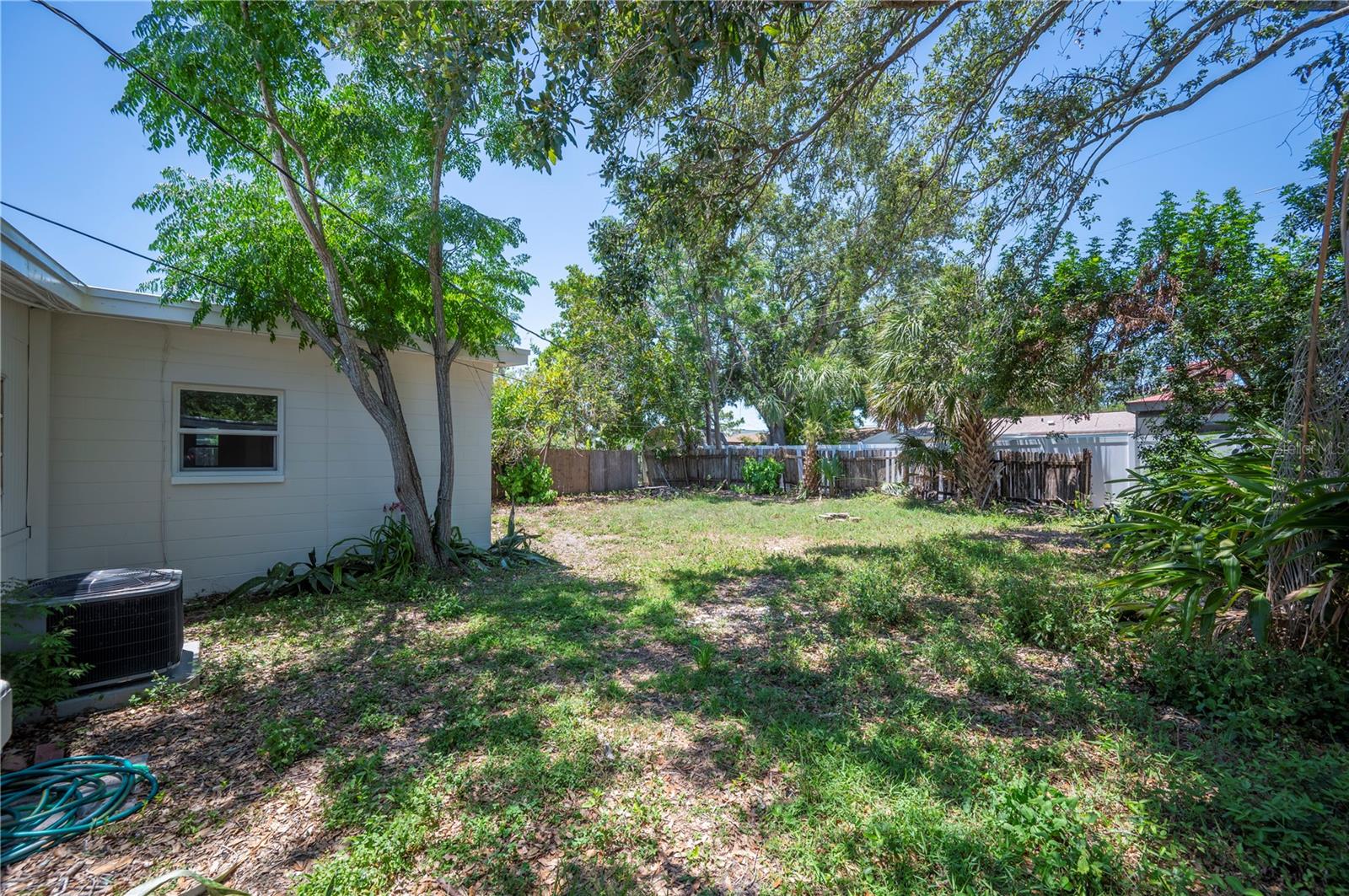 LARGE YARD WITH PLENTY OF ROOM FOR ENTERTAINING OR MAN'S BEST FRIEND OR A PRIVATE OASIS