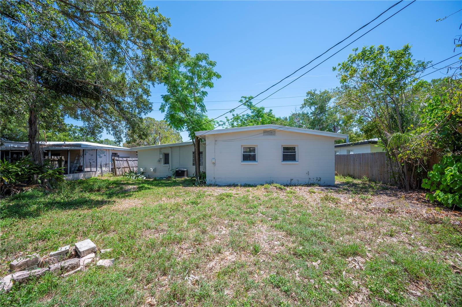 LARGE YARD WITH PLENTY OF ROOM FOR ENTERTAINING OR MAN'S BEST FRIEND OR A PRIVATE OASIS