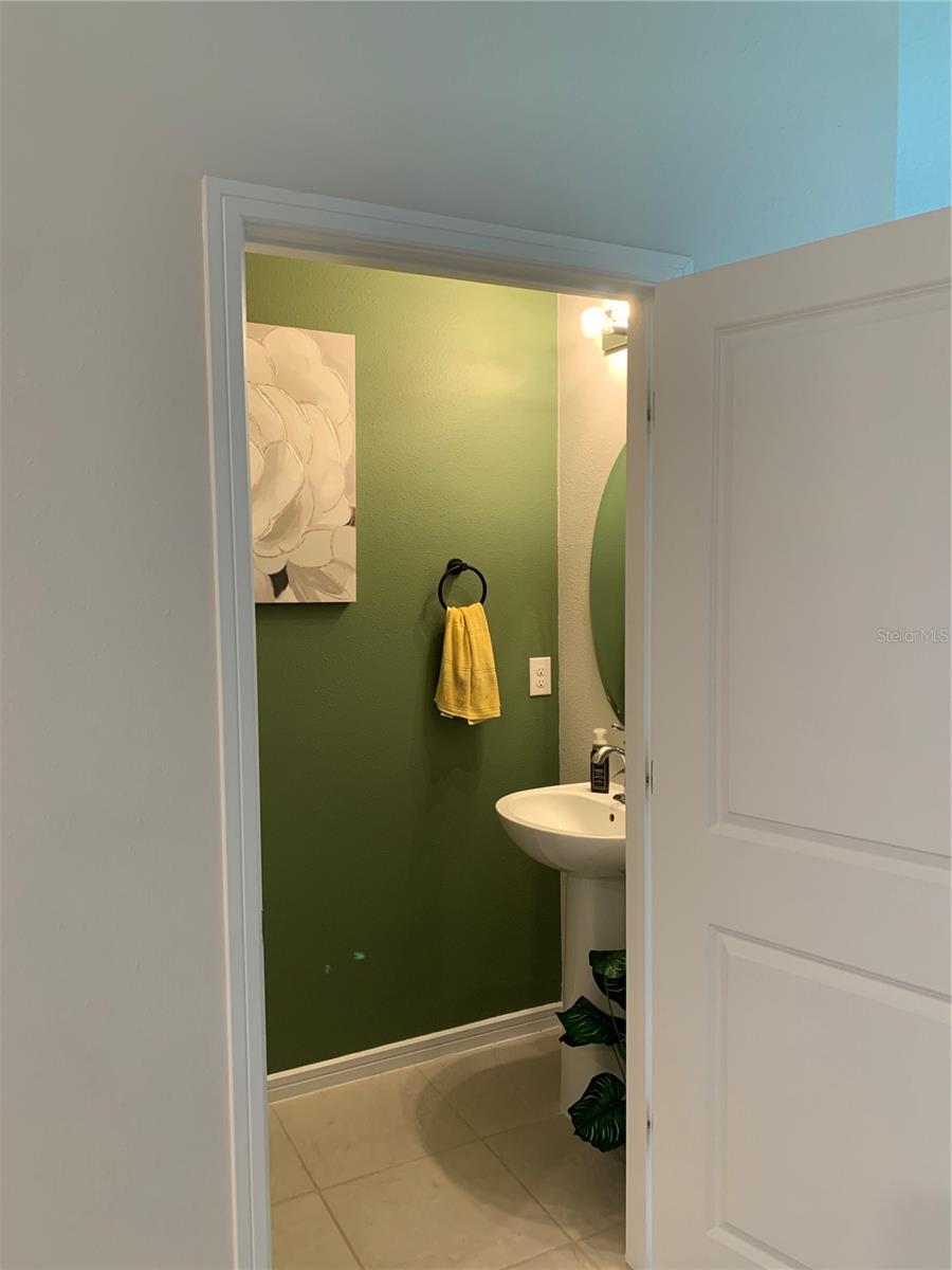 Looking into half bath from kitchen area