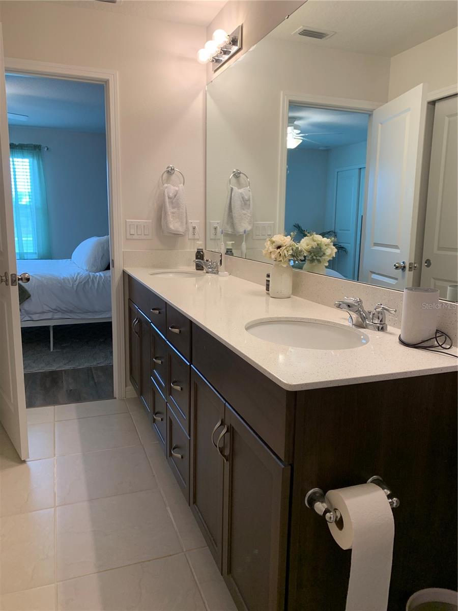 Primary restroom looking into bedroom