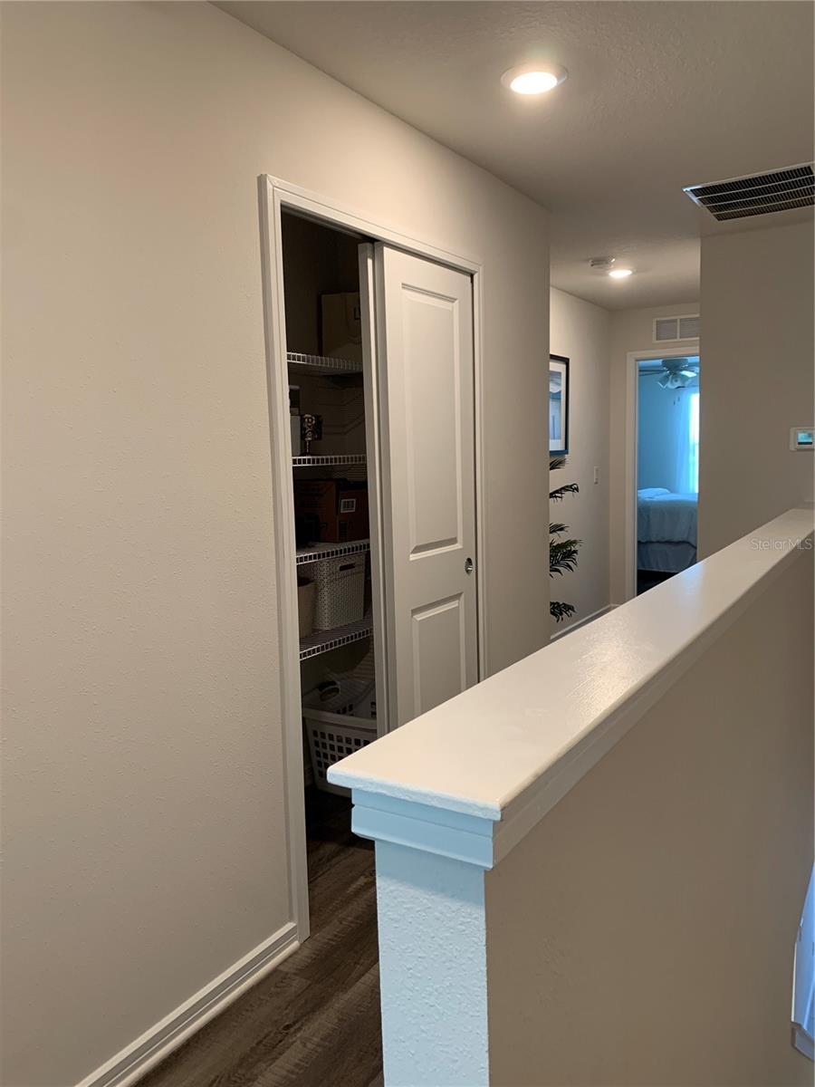 Upstairs looking toward linen closet and 2nd bedroom in distance