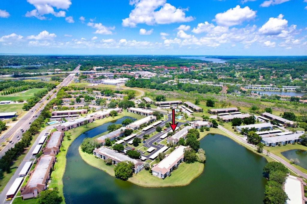 drone photo of the condo building with lake view