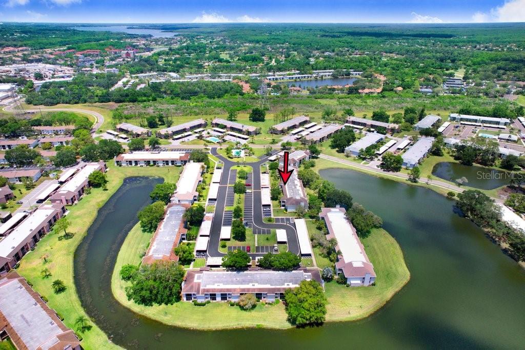 drone photo of the condo building with lake view